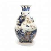 Chinese pottery vase blue and white glazed, 20th century. Decorated with red enamel and a relief dra