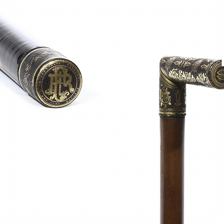 Two canes with damascened iron handle, 20th century