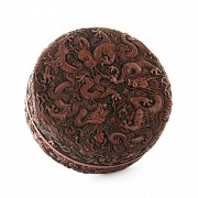 A carved cinnabar lacquer 