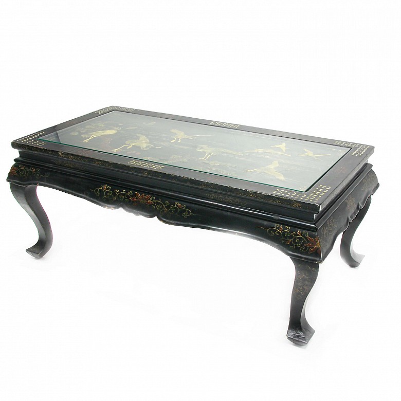 Black lacquered wooden table.