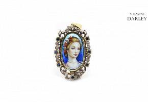 Medal with a portrait in enamel, surrounded by diamonds and sapphires.