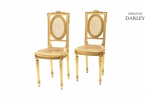 Pair of golden wood chairs, seat and backrest of grid, Louis XVI style,