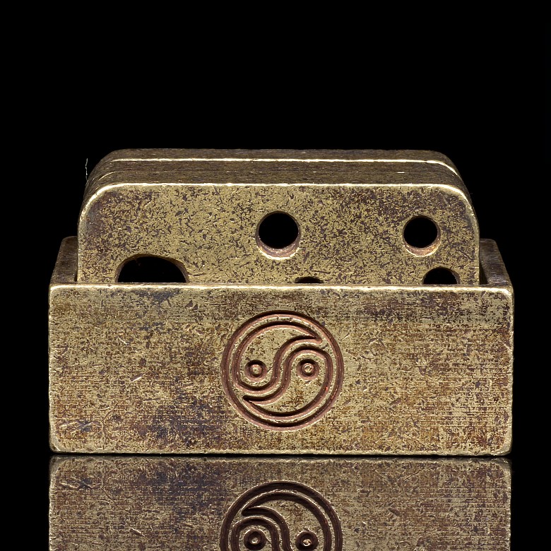 Set of three bronze stamps.