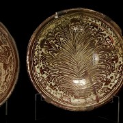 Two deep plates and a bowl in metallic lustre 