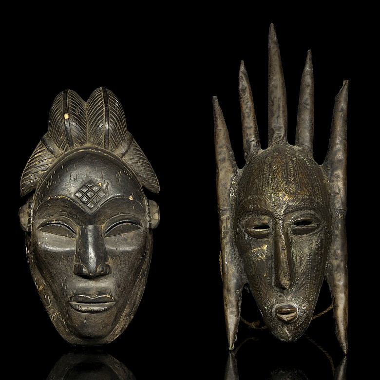 Two carved wooden African ceremonial masks, 20th century