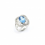 18k white gold ring with blue topaz and diamonds.
