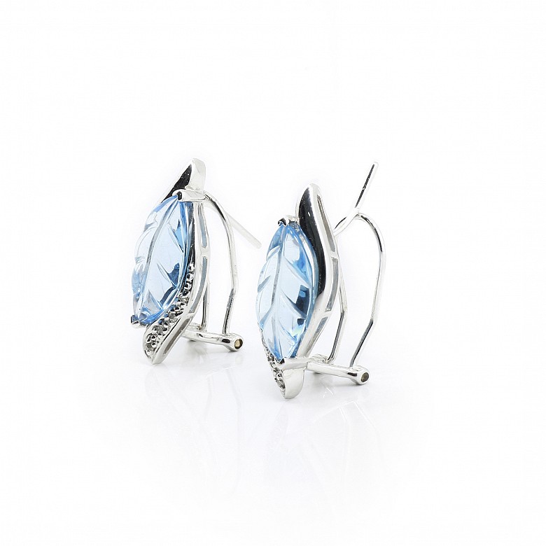 18k white gold earrings with topaz and diamonds.