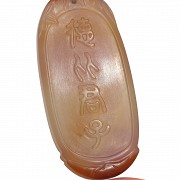 Oval agate plaque and a silk pouch, Qing dynasty