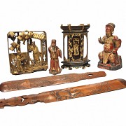 An antique polychrome carved wood group of six figures.