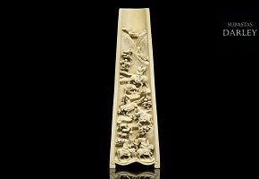A carved ivory wrist rest, 19th century