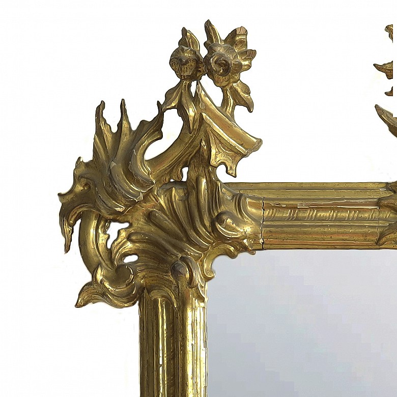 Carved and gilded wooden mirror, 19th century