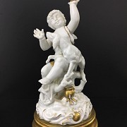 White ceramic angel figure, painted with gold leaf. - 1