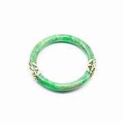 Green jade bangle set in 14k yellow gold