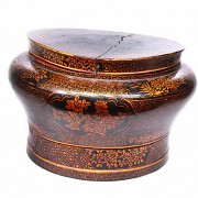 Large lacquered wooden Chinese box with metal base.