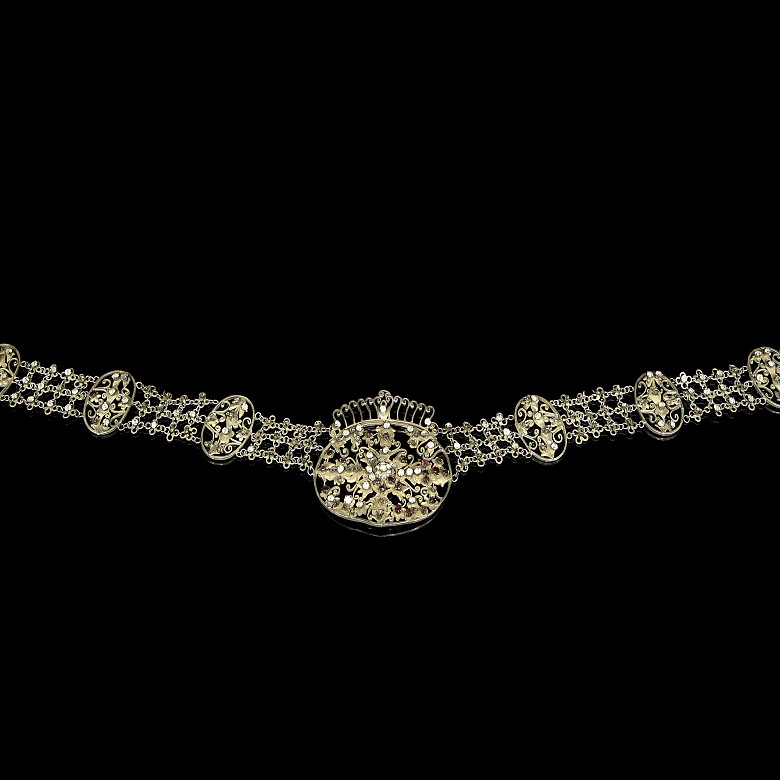 Indonesian belt in silver-plated metal with gem-set glass.